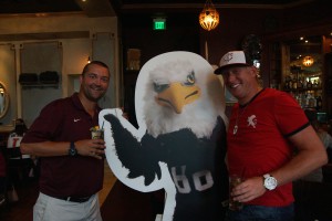 Auggies pose with Auggie Eagle stand-up figure